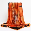 Close-up of bright orange floral silk scarf with glossy satin finish and elegant drape - 90x90cm / Orange Edge (FT253-4)
