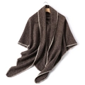 Detailed close-up of dark brown cashmere-like knit shawl with cream blanket stitch edges - Coffee