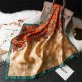 Silk-like orange maple leaf print square scarf draped on a handbag with pearls - 70x70cm / Cyan Edge (FJ832-2)
