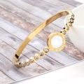 Detail of 18K gold-plated stainless steel bangle with roman numerals and zircons - Gold