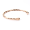 Detail of twisted cable cuff bracelet in rose gold finish with ribbed end caps - Rose Gold