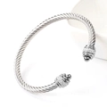 Macro view of twisted cable titanium steel bangle with sparkling pavé set rhinestones - Steel Color With White Zirconia And Steel Bead