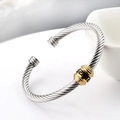 Silver cable cuff bangle with a golden Greek key engraved cylinder bead accent - Two-tone Silver and Gold (Gold Center)