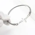 Silver heartbeat cable wire cuff bracelet in minimalist stainless steel design - Silver