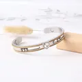 Bracelet jonc magnétique en acier titane avec breloque cœur et bords tressés dorés - Or Bicolore (Fil d'Or)