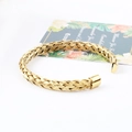 Golden woven mesh cuff bracelet in stainless steel with cylindrical end caps - Gold