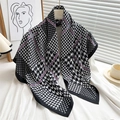 Detail of classic black and white houndstooth scarf with purple accents and silk-like texture - 90x90cm / Black Purple