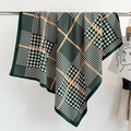 Detail of green houndstooth silk scarf showing fine rolled edges and fashion logo print - 90x90cm / Army Green