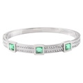 Macro view of silver steel bracelet featuring square emerald gems and pavé zircon stones - Silver Color Green Zirconia