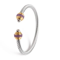 Close-up of a silver cable bracelet featuring gold ends and purple beaded accents - Gold-Silver Purple/Steel Bead