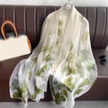 Elegant white chiffon scarf with green ginkgo leaf print displayed on a sofa - 190x130cm / Green (Ginkgo Leaf Print)