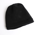 Detail of pure black knitted beanie featuring fine horizontal stripes and ribbed texture - One Size / Black