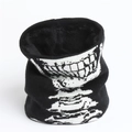 Detail of winter neck warmer featuring skull teeth knit pattern and thick black fleece lining - Black