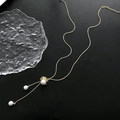 Adjustable gold snake chain sweater necklace with three elegant white pearls - Gold
