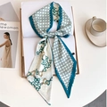 Elegant green chain pattern satin skinny scarf styled on a magazine and coffee table - Dark Green Honeycomb Chain (LE-250)