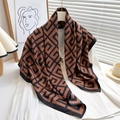 Detail of silk scarf with brown geometric maze pattern draped over a white blouse - 90x90cm / Orange Black (FN169-4)