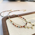 Zweilagige Edelstahlkette mit bunten Natursteinperlen und goldenen Anhängern - Gold