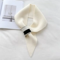 Creamy white knitted scarf with striped cross-over loop on a minimalist background - Off-white