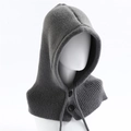 Close-up of grey knitted balaclava hood showing textured wool and black button detail - Gray