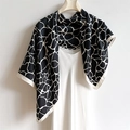 Abstract black and white geometric silk scarf draped on a hanger with silky texture - Large Square Scarf Style / Black (FN162-1)