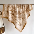 Detailed texture of brown paisley silk scarf with vintage belt and chain patterns - Khaki