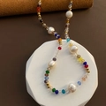 Close-up of handmade rainbow beaded necklace with natural pearls on geometric pedestal - Rainbow Glass Irregular Artificial Pearl Style (1-4-8)