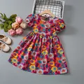 Detailed flat lay of floral print girls dress with puff sleeves and wood hanger - 90cm / Rose Red
