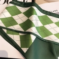 Elegant green argyle silk scarf with geometric pattern neatly folded on a magazine - Green Argyle (LE-104)