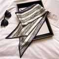 Elegant leopard print thin silk scarf with diagonal ends styled on a black tray - Beige Gold (LE-102)