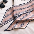 Close-up of pink and blue leopard print narrow silk scarf with premium edge stitching - Light Pink (LE-103)