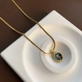Gold snake chain necklace with a vintage rose abalone shell pendant on a white tray - Abalone Shell Flower Necklace Copper Pendant (03-C10)
