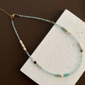 Light blue beaded titanium steel necklace with turquoise accents and a white pearl - Green Beads (05-F24)
