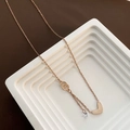 Rose gold heart pendant necklace with interlocking rings and zircon on a white stand - Rose Gold