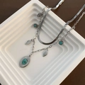 Collana a doppio strato in acciaio titanio argento con foglie e ciondoli turchesi - Argento
