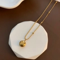 Collana a doppia catena dorata con pendente a sfera portafortuna e incisione elegante - Collana a Chicco in Acciaio al Titanio Oro