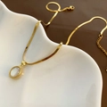Elegant gold herringbone chain necklace featuring an oval white stone teardrop pendant - White Shell Oval Style (1-7#3) / Gold