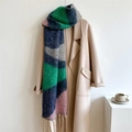 Detail of color-block knit scarf with navy, green, grey, pink panels and fringe tassels - Teal