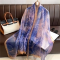 Elegant large gradient silk shawl with blue and pink floral patterns on a leather sofa - Blue Purple Pink Gradient Floral (YRS61-1)