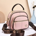 Pink lychee grain multi-layer crossbody bag with brown handle and floral woven strap - Pink