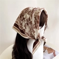 Detail of a brown Toile de Jouy floral silk scarf styled on a model head for a French look - French Retro Brown and Beige (FR38-3)