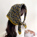Retro paisley square headscarf in black and ginger yellow worn on a mannequin - 68x68cm / Black (FR35-2)