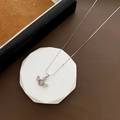 Pink cat-eye heart necklace with winged cubic zirconia stones on white pedestal - Silver
