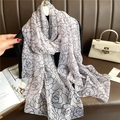 Close-up of lightweight chiffon shawl featuring elegant black and white floral rose patterns - White Base Black Flowers (YRS32-1)