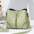 Elegant mint green bucket bag with geometric texture and golden cat tassel charm - Green