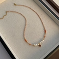 Elegant freshwater pearl necklace with red gemstone pendant on warm champagne beaded chain - Square Ruby Artificial Pearl Style (xk-324)