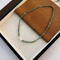 Sweet beaded necklace with green stone beads, white pearls and gold metal accents - Green Semi-transparent Discs and Double Pearl Necklace (03-I14)