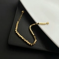 Minimalist golden titanium steel bracelet with cube beads and adjustable chain closure - Gold