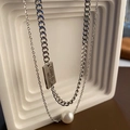 Detail of layered titanium steel necklace featuring a pearl and engraved rectangular tag - Double Layer Stainless Steel Necklace Set (02-A3)