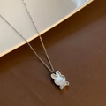 Silver rabbit necklace with heart-shaped mother-of-pearl inlay and bow detail - Silver
