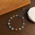 Bracelet marguerite et papillon en argent avec des breloques florales en émail coloré - Bracelet